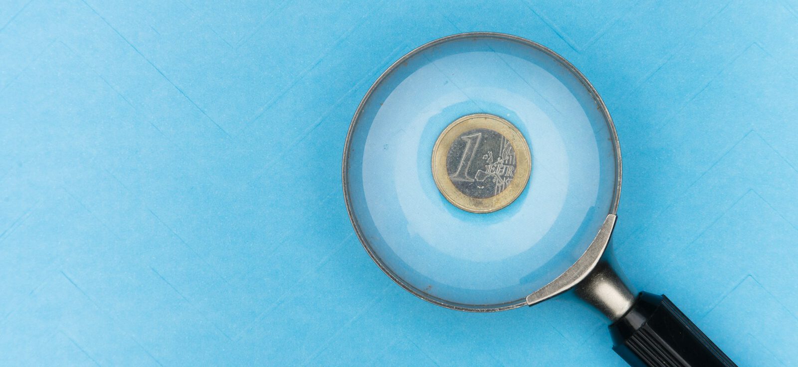 round grey and black magnifying glass